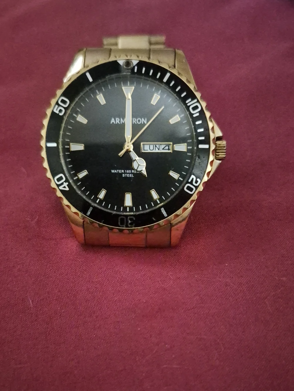 Armitron Gold-Tone Watch with Black Dial and Day-Date